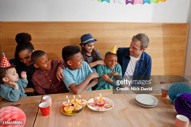 Family with five children celebrating birthday