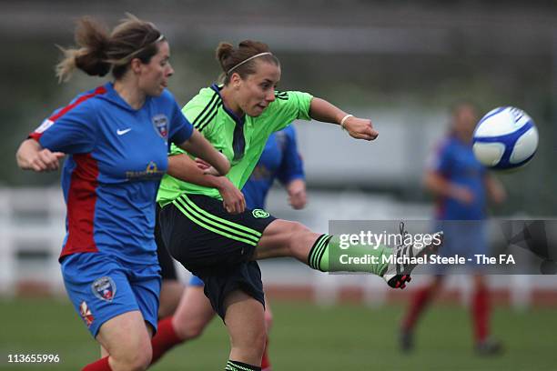 Rebecca Jane of Chelsea shoots as Emma Jones challenges during the FA Women's Super League match between Bristol Academy Women's FC and Chelsea...