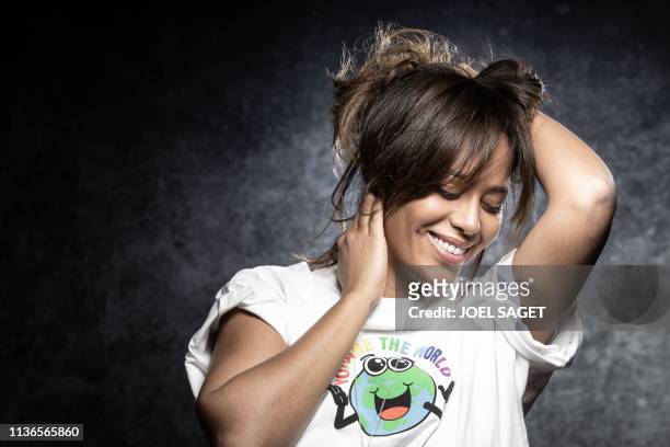 French singer Amel Bent poses during a photo session during the 2nd edition of the Cannes International Series Festival on April 9, 2019 in Cannes,...
