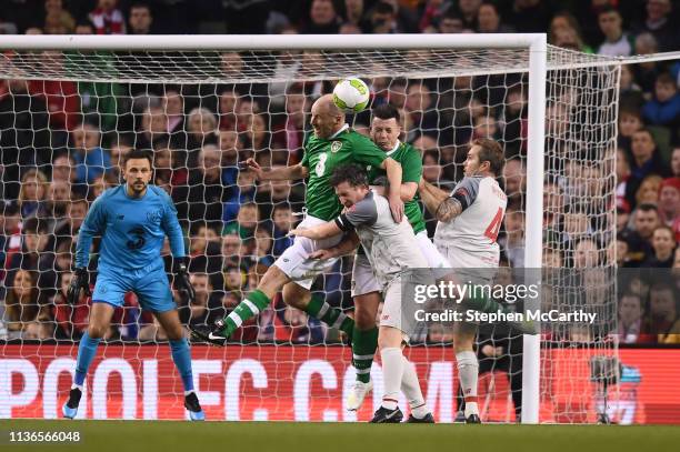 Dublin , Ireland - 12 April 2019; Kenny Cunningham and Ian Harte of Republic of Ireland XI in action against Robbie Fowler and Jason McAteer of...