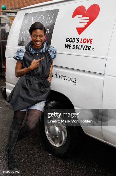 Celebrity AIDS Activist Suzanne Africa Engo wearing Kenneth Cole Aids Awearness rain poncho encourages others to volunteer for Gods Love We Deliver...