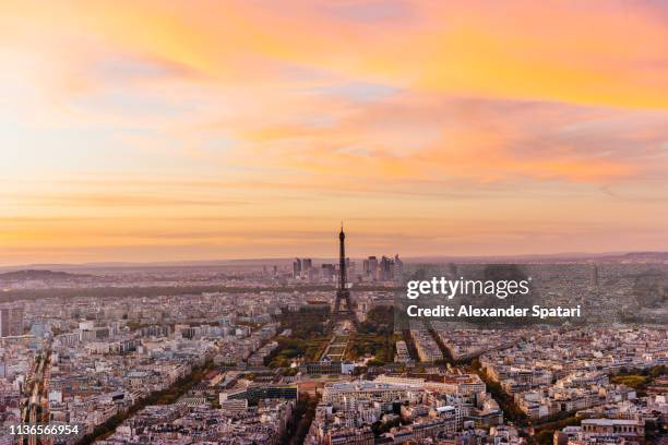 aerial view of paris skyline with eiffel tower during dramatic colorful sunset - eiffel tower aerial view stock pictures, royalty-free photos & images