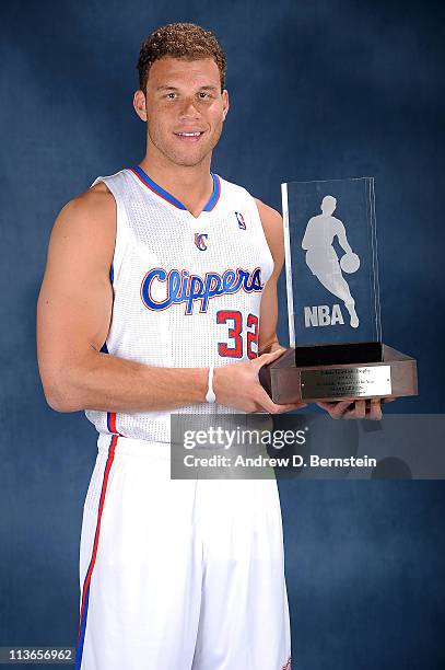 Blake Griffin of the Los Angeles Clippers poses for a picture with the 2010-2011 T-Mobile Rookie of the Year Award during a ceremony at the Clippers...