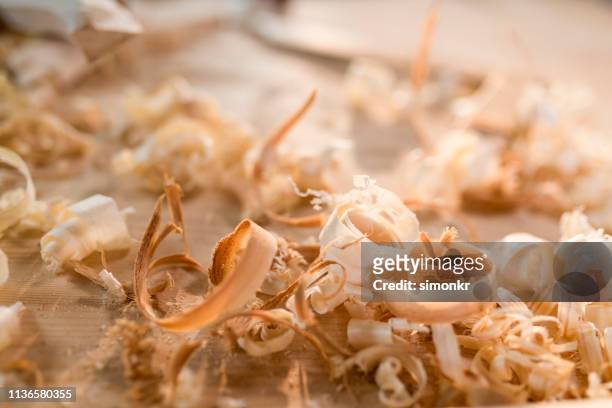 wood shavings on table - sawdust stock pictures, royalty-free photos & images