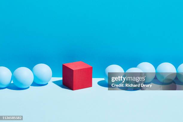 conceptual image of geometric blocks - rebellion stockfoto's en -beelden