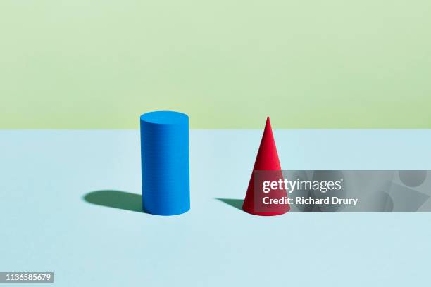 conceptual image of geometric blocks - a cone stock-fotos und bilder