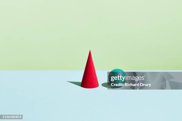 conceptual image of geometric blocks - a cone stock-fotos und bilder