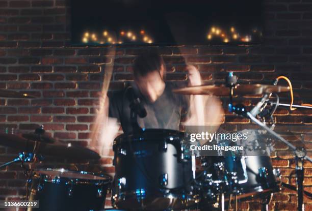 drummer performing in a bar - musician stock pictures, royalty-free photos & images