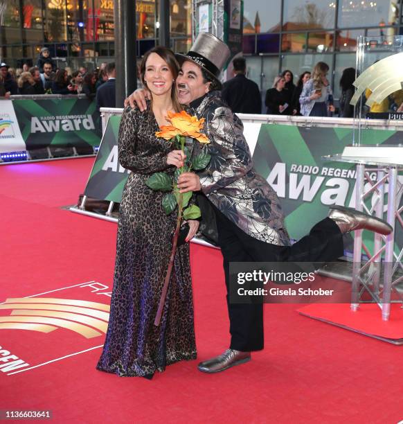 Carolin Kebekus and Charlie Chaplin look a like during the Radio Regenbogen Award at Europapark on April 12, 2019 in Rust, Germany.