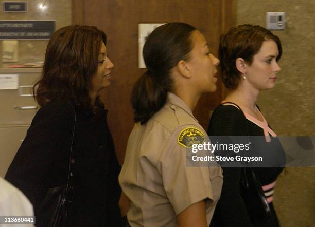 Actress Winona Ryder is seen through a tinted glass as she arrives at the Beverly Hills Municipal Court House in her trial on charges of alleged...