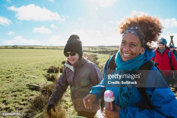 happy female walkers - british culture walking stock pictures, royalty-free photos & images