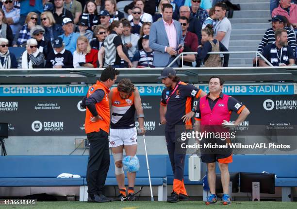 Wayne Campbell consoles Callan Ward of the Giants during the 2019 AFL round 04 match between the Geelong Cats and the GWS Giants at GMHBA Stadium on...