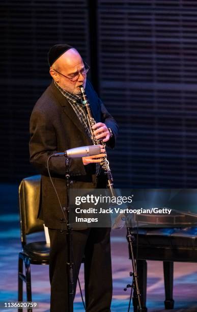 American Klezmer musician Andy Statman plays clarinet as he performs with his trio during a concert in the 'Migrations: The Making of America' series...