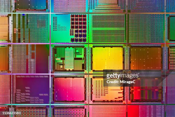 multi colored computer wafer macrophotography - circuito stock pictures, royalty-free photos & images
