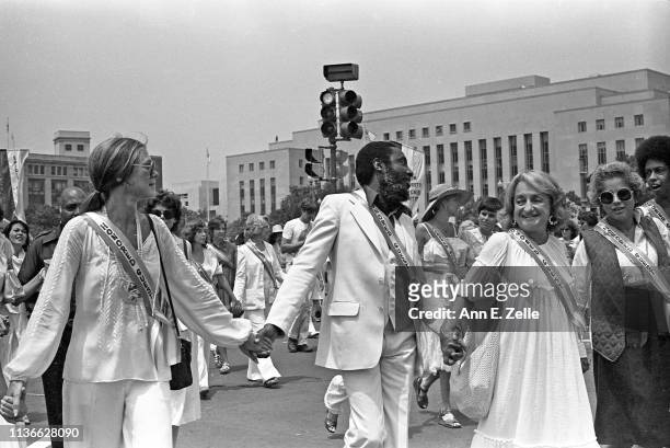 View of activists, from left, journalist Gloria Steinem, comedian Dick Gregory , writer Betty Friedan , and US Secretary of Housing and Urban...