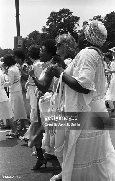 Along with others, American actress Esther Rolle sings during the Equal Rights Amendment March, Washington DC, July 9, 1978. Among those visible in...