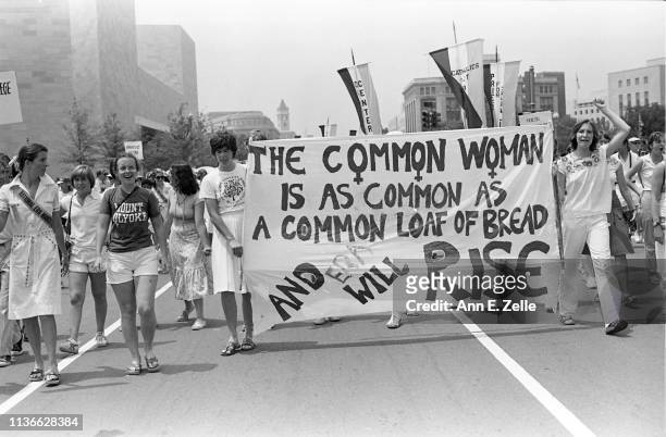 View of demonstrators as they carry banners and signs on Pennsylvania Avenue during the Equal Rights Amendment March, Washington DC, July 9, 1978....