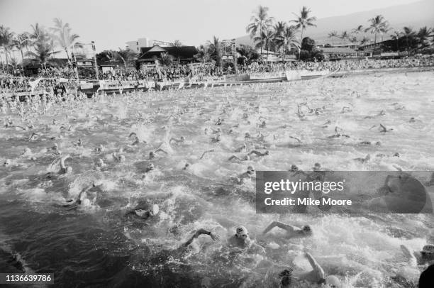 Triathletes competing in the first part of the long-distance triathlon race Ironman VII at Kailua-Kona, Hawaii, US, 28th October 1983.