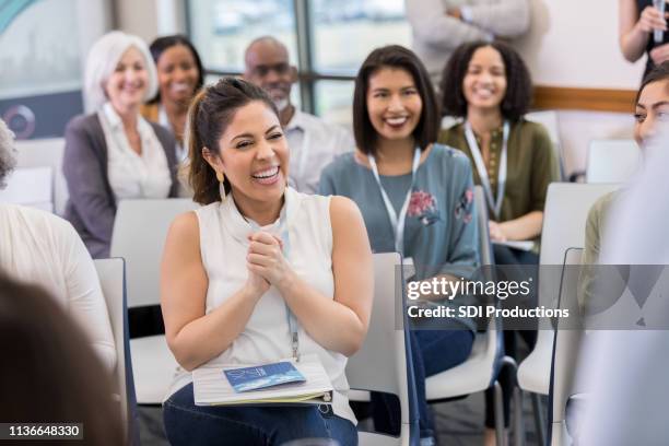 happy woman applauds during seminar - laughing audience stock pictures, royalty-free photos & images