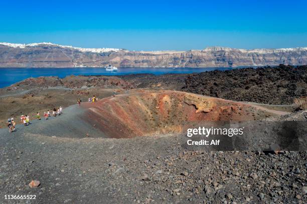 volcano (nea kameni) of the island of santorini in greece - santorini volcano stock pictures, royalty-free photos & images