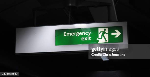 hanging emergency exit sign - 非常��口 ストックフォトと画像