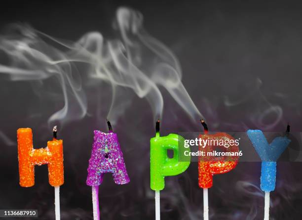 happy birthday candles blown out. - birthday candle on black stock pictures, royalty-free photos & images