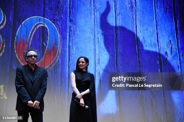 Tim Burton and Eva Green attend the “Dumbo” Paris Gala Screening at Cinema Le Grand Rex on March 18, 2019 in Paris, France.