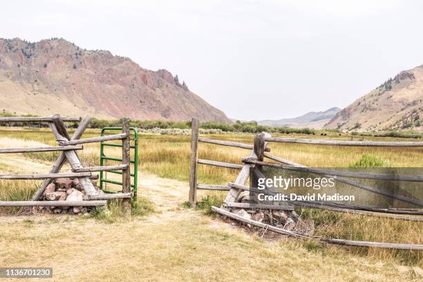 log fence and metal gate in recreation area along beaverhead river near dillon, montana - dillon montana stock pictures, royalty-free photos & images