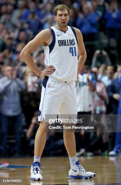 Dirk Nowitzki of the Dallas Mavericks reacts after scoring a basket against Kenrich Williams of the New Orleans Pelicans to become the sixth all-time...