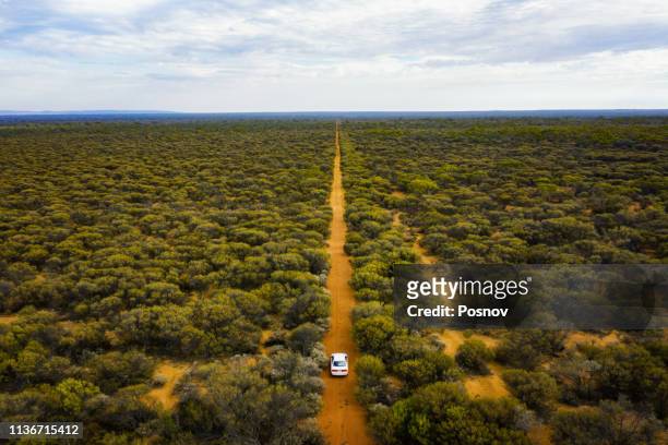 driving through the bush land - australia occidental fotografías e imágenes de stock