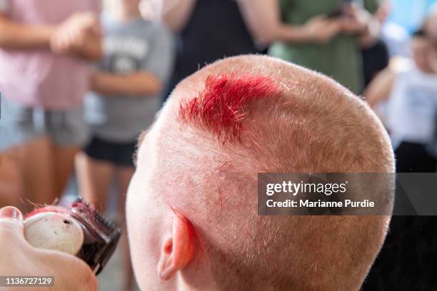 a lady having her head shaved - shaved head ストックフォトと画像