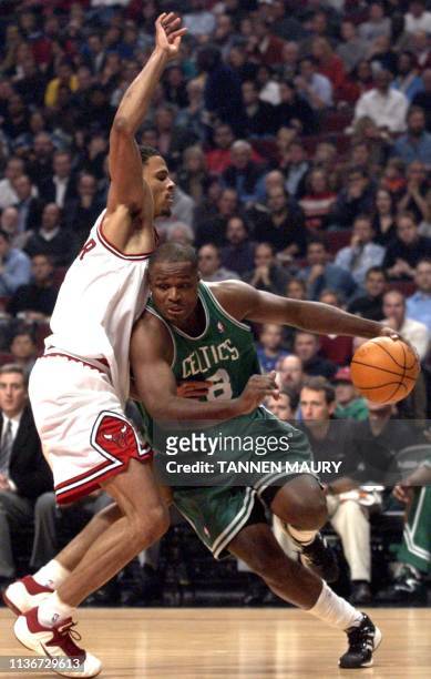 Boston Celtics forward Antoine Walker works his way around Chicago Bulls forward Tyson Chandler in the first half of their NBA matchup 06 November...