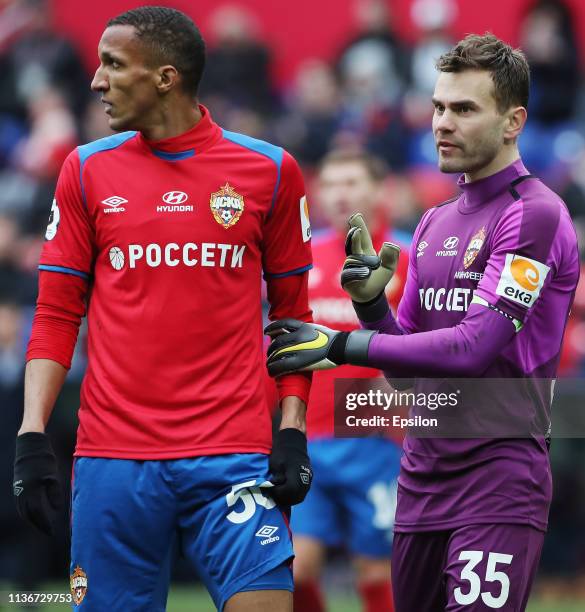 Igor Akinfeev talks with Rodrigo Becao of PFC CSKA Moscow during the Russian Premier League match between PFC CSKA Moscow and FC Orenburg on April...