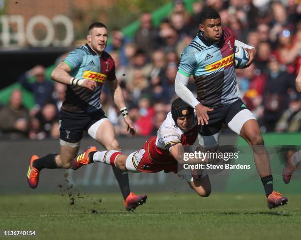 Nathan Earle of Harlequins is tackled by Piers Francis of Northampton Saints during the Gallagher Premiership Rugby match between Harlequins and...