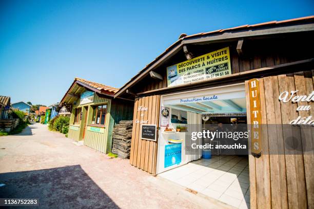 oysters degustation in cap-ferret fisherman's village, france - arcachon stock pictures, royalty-free photos & images