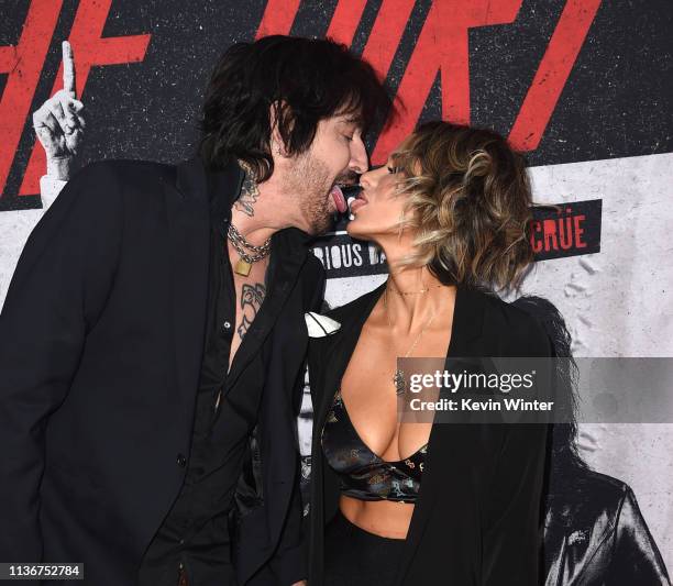 Tommy Lee and Brittany Furlan arrive at the premiere of Netflix's "The Dirt" at ArcLight Hollywood on March 18, 2019 in Hollywood, California.