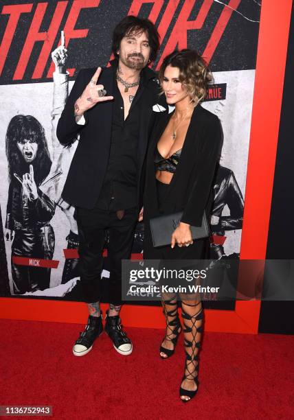 Tommy Lee and Brittany Furlan arrive at the premiere of Netflix's "The Dirt" at ArcLight Hollywood on March 18, 2019 in Hollywood, California.