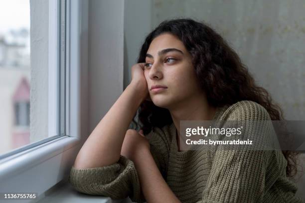 sad unhappy teenage girl - teenage girls stock pictures, royalty-free photos & images