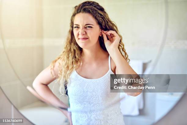 i should clean my ears more often - cotonete imagens e fotografias de stock