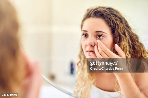 gaining clearer vision first thing in the morning - contact lens stock pictures, royalty-free photos & images