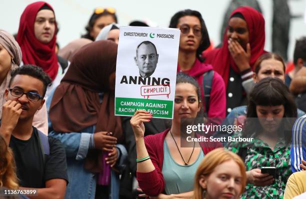 Protesters hold placards aloft as they march during the Stand Against Racism and Islamophobia: Fraser Anning Resign! rally on March 19, 2019 in...