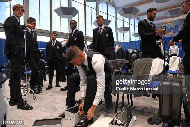 Genarl view of players dressing up ahead of the Italy team photo with the new Armani suit at Centro Tecnico Federale di Coverciano on March 19, 2019...