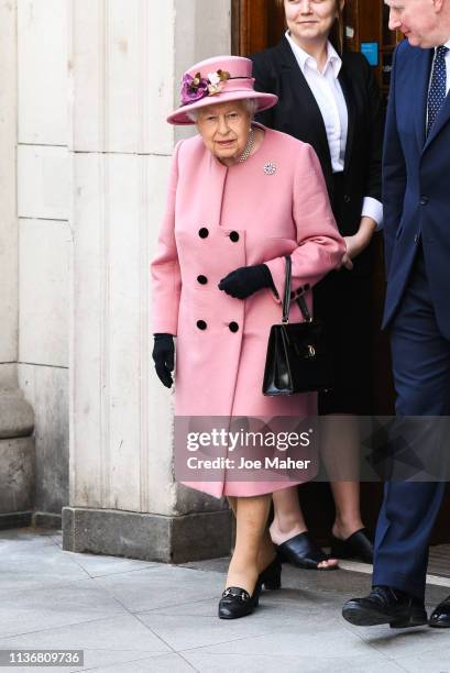 Queen Elizabeth II accompanied by and Catherine, Duchess of Cambridge visit King's College London on March 19, 2019 in London, England to officially...