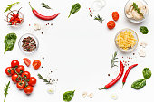 Colorful pizza ingredients on white background, top view