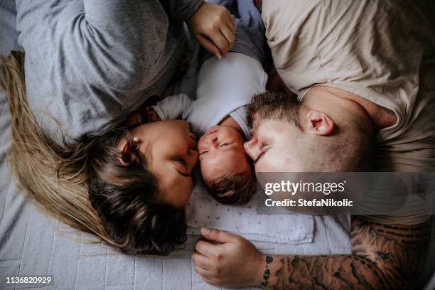 lovely family enjoying day at home - baby with parents imagens e fotografias de stock