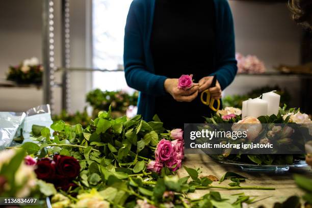 creativity at work - florist arranging stock pictures, royalty-free photos & images