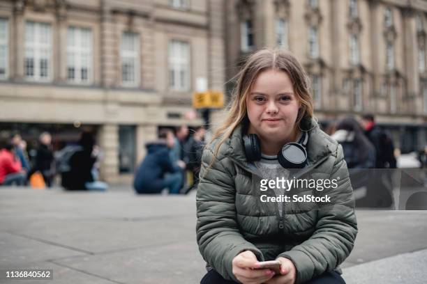 portrait of a young female adult - persons with disabilities stock-fotos und bilder