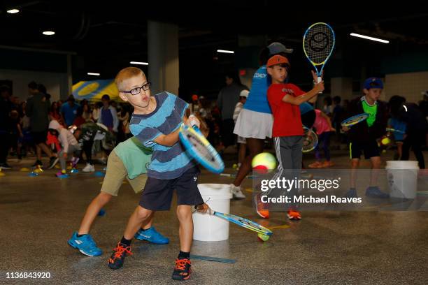 Young children take part in the Kids Day event during the Miami Open Presented by Itau on March 19, 2019 in Miami Gardens, Florida.