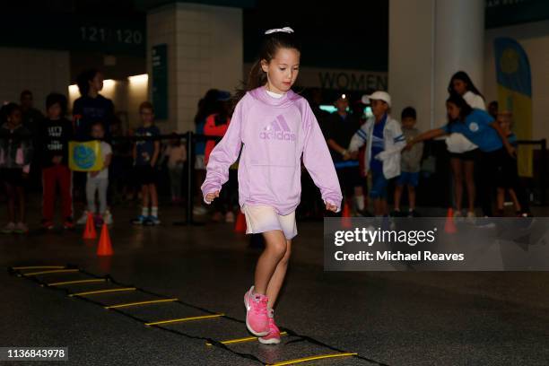 Young children take part in the Kids Day event during the Miami Open Presented by Itau on March 19, 2019 in Miami Gardens, Florida.