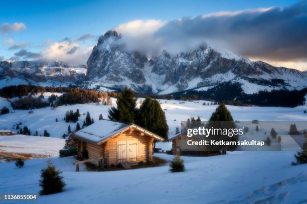 a view of seiser alm in winter, dolomite, italy - alpine chalet stock pictures, royalty-free photos & images